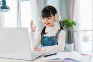 Portrait of a girl studying online at home