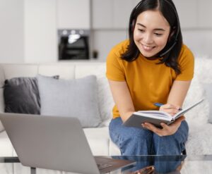 woman-with-headset-video-call-laptop